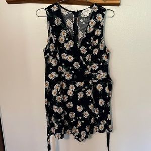 M Everly flowers on dark blue romper.